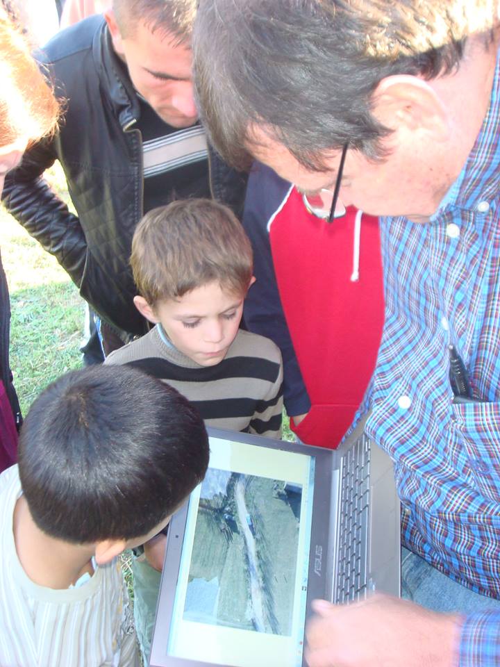 showing small UAV photography to the young