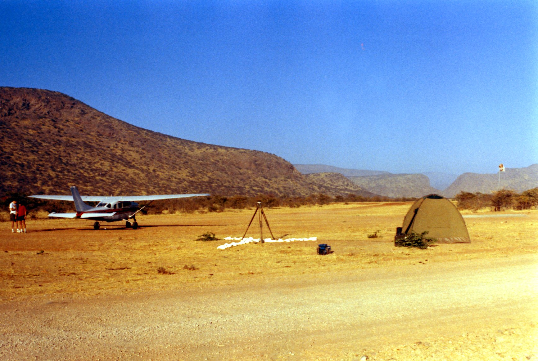 Walter Volkmann using a plane to deliver GPS receivers to different places in Namibia on surveying jobs